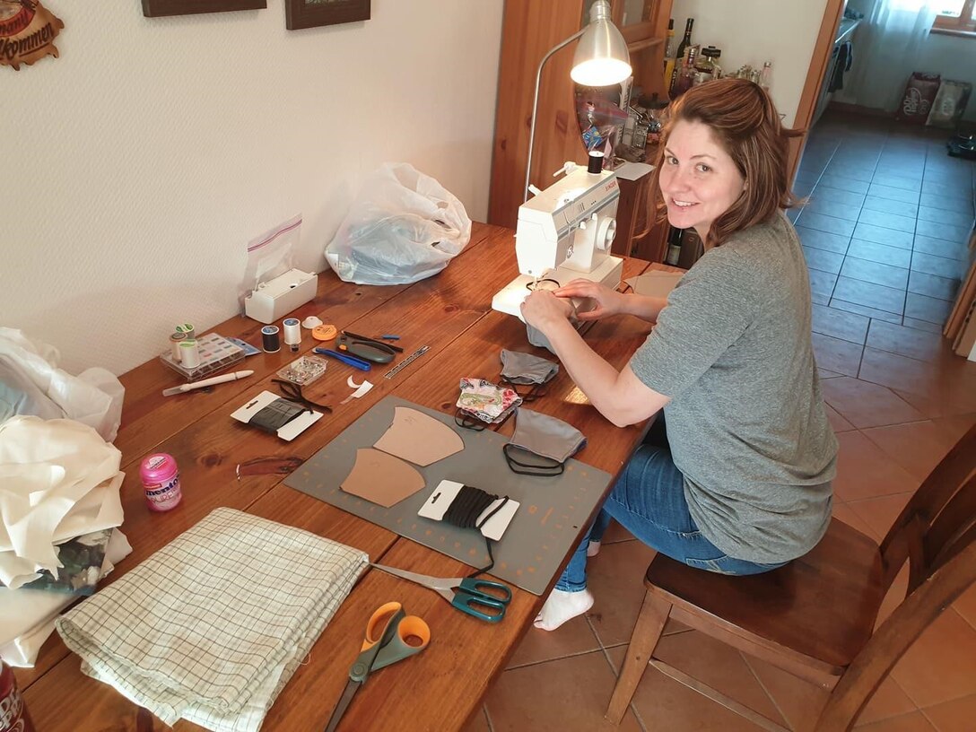 Kelly Westerlund, 470th Air Base Squadron spouse, sews masks for members of the 470th ABS in Geilenkirchen, Germany, April 20, 2020. Many spouses and members volunteered to make masks for the ongoing COVID-19 pandemic. (U.S. Air Force photo courtesy of Master Sgt. David Zamora-Alvarez)