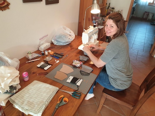 Kelly Westerlund, 470th Air Base Squadron spouse, sews masks for members of the 470th ABS in Geilenkirchen, Germany, April 20, 2020. Many spouses and members volunteered to make masks for the ongoing COVID-19 pandemic. (U.S. Air Force photo courtesy of Master Sgt. David Zamora-Alvarez)