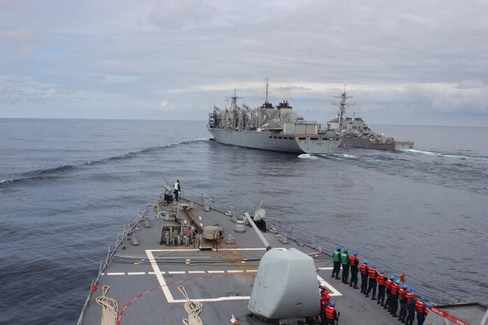 NORTH ATLANTIC (April 28, 2020) - The Arleigh Burke-class guided-missile destroyer USS Donald Cook (DDG 75) makes her approach alongside USNS SUPPLY (T-AOE 6) and USS Porter (DDG 78) for a connected replenishment (CONREP) to receive fuel and stores, April 28, 2020. CNE-CAN/C6F, headquartered in Naples, Italy, oversees joint and naval operations, often in concert with Allied, joint, and interagency partners, in order to advance U.S. national interests and security and stability in Europe and Africa. (U.S. Navy photo by Yeoman Third Class Anthony Nichols/Released)