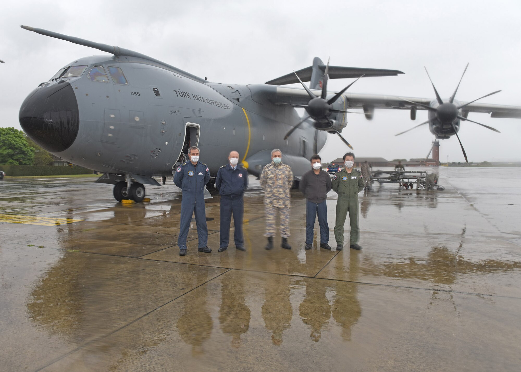 Group Capt. Tamer Tufekci, center, Turkish Air Attaché from the Turkish Embassy in London, poses for a photo with members of the Turkish air force during a refueling stop at RAF Mildenhall, England, April 28, 2020. The crew were on their way to Joint Base Andrews, Md., to deliver COVID-19 medical supplies including gloves, goggles, masks and hand sanitizer. (U.S. Air Force photo by Karen Abeyasekere)