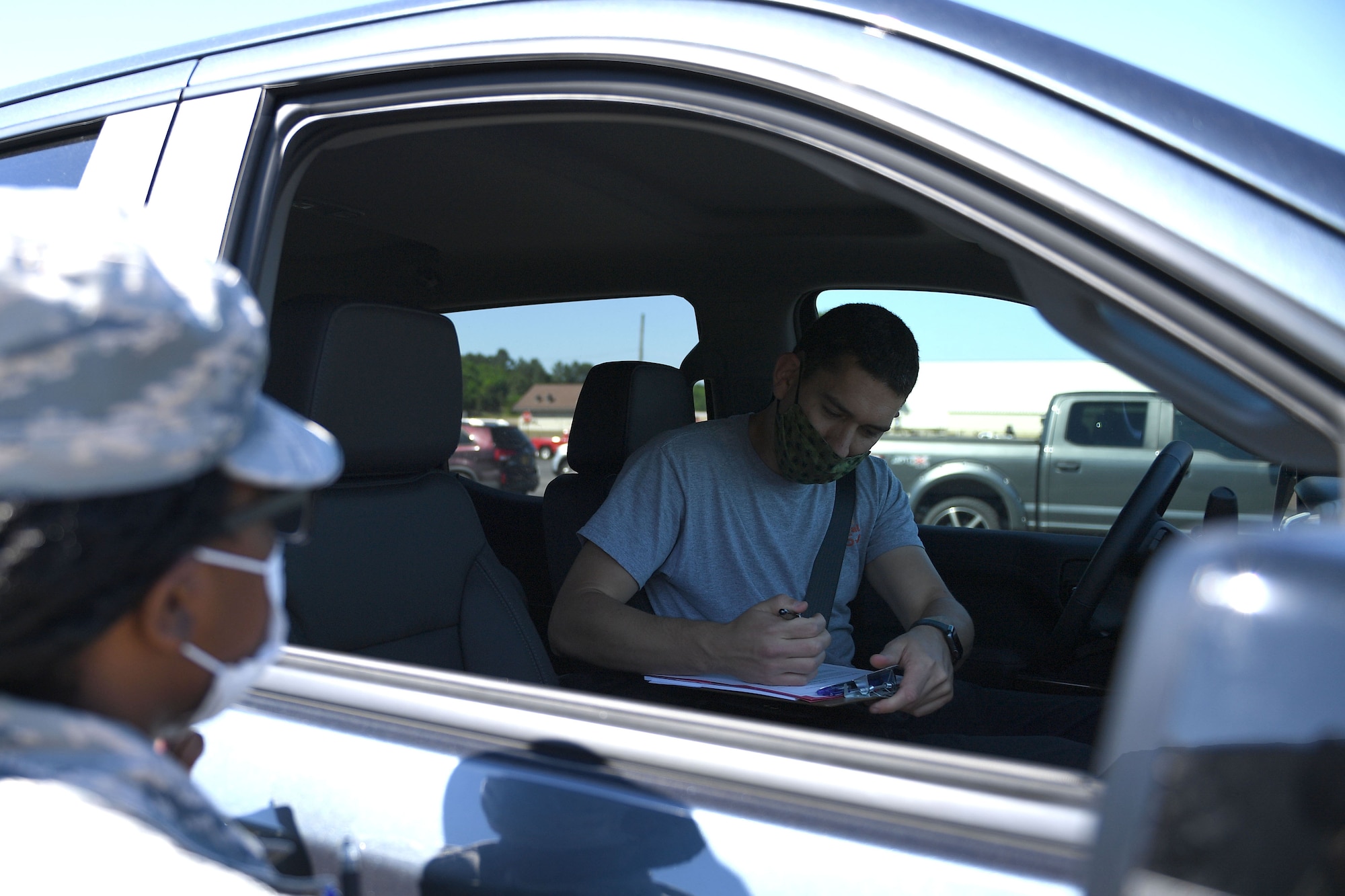 A man signs a paper