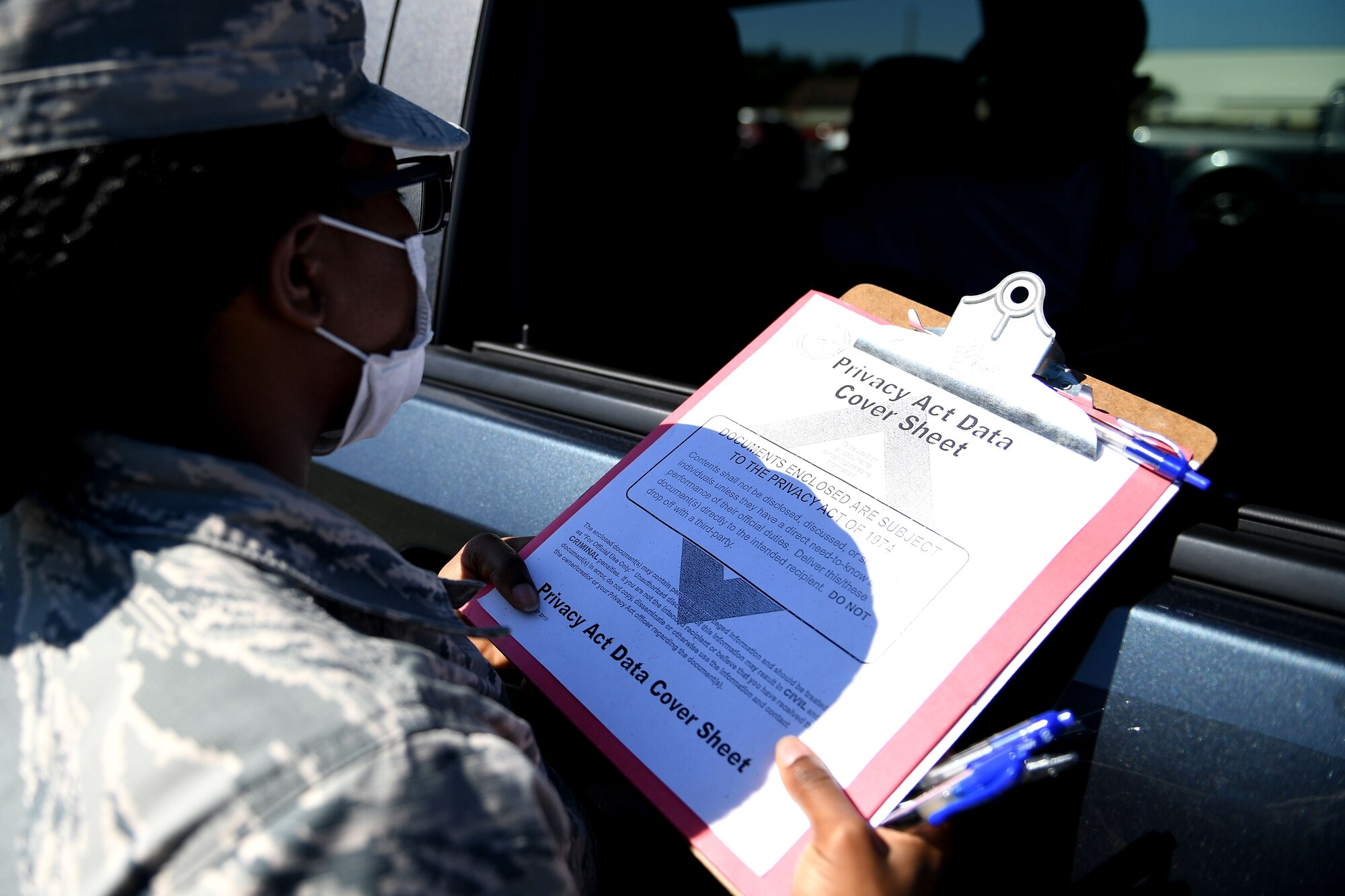 a paper is being shown.