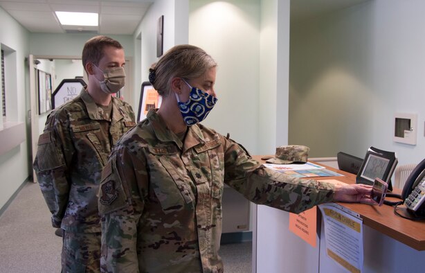 Lt. Col. Jen Wylie, 919th Special Operations Medical Squadron medical services director and Staff Sgt. Erich Miller, 919th SOMDS operational medical technician, attend a virtual morning meeting at Duke Field, Fla., April 13, 2020.
