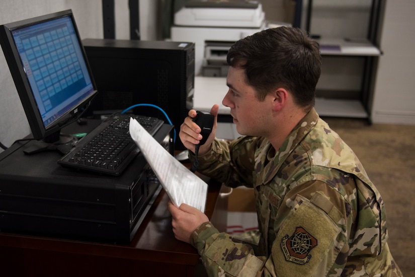 Airman 1st Class Joseph Arnold, an emergency actions controller assigned to the 628th Air Base Wing Command Post, demonstrates how to broadcast a verbal tornado warning with siren simultaneously while using the Giant Voice notification system on the Air Base and Naval Weapons Station at Joint Base Charleston, S.C., April 20, 2020. The tornado warning and siren are used to warn personnel outdoors to seek shelter in the event of a tornado. Arnold is one of several Command and Control Operations specialists who work rotating shifts around the clock to man Palmetto Ops at the command post. The command post remains vigilant and operates 365 days a year to provide command and control support to the base as needed.