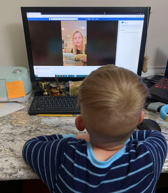 Harrison Masteller, 3, son of U.S. Army Sgt. 1st Class Bruce Masteller, 128th Aviation Brigade Advanced Individual Training instructor, watches the virtual Evening Story Time on the Fort Eustis Regimental Memorial Chapel Facebook page, April 30, 2020.