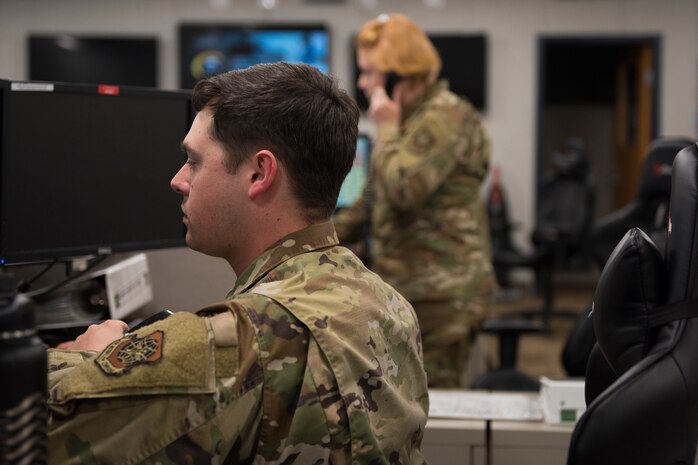 Airman 1st Class Joseph Arnold, an emergency actions controller assigned to the 628th Air Base Wing Command Post, demonstrates how to broadcast a verbal tornado warning with siren simultaneously while using the Giant Voice notification system on the Air Base and Naval Weapons Station at Joint Base Charleston, S.C., April 20, 2020. The tornado warning and siren are used to warn personnel outdoors to seek shelter in the event of a tornado. Arnold is one of several Command and Control Operations specialists who work rotating shifts around the clock to man Palmetto Ops at the command post. The command post remains vigilant and operates 365 days a year to provide command and control support to the base as needed.