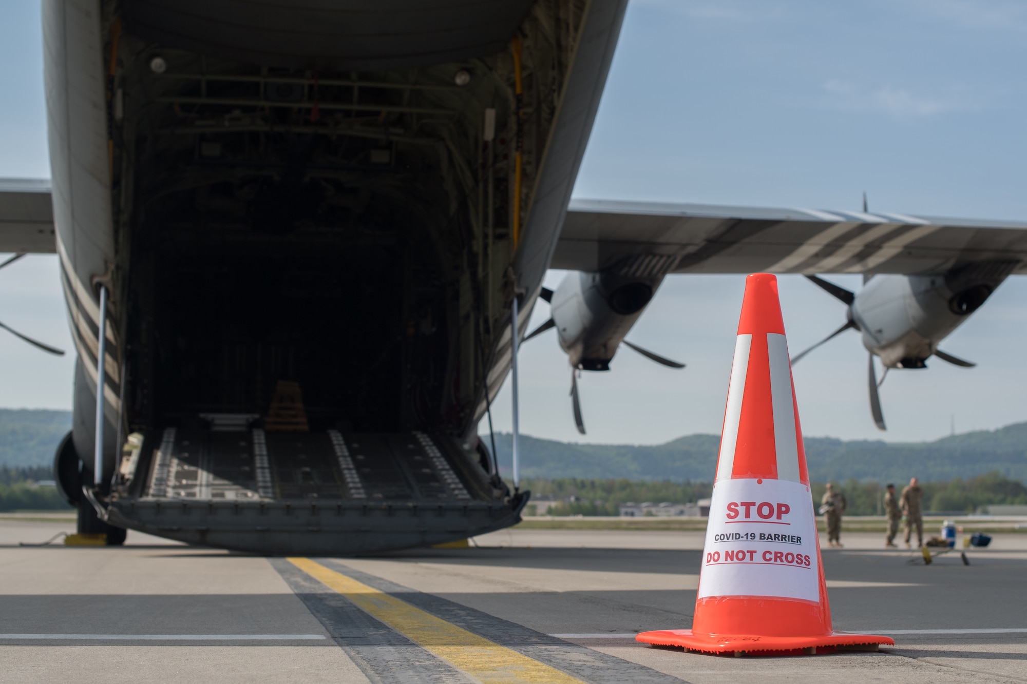 Safety cone sits beside an aircraft.