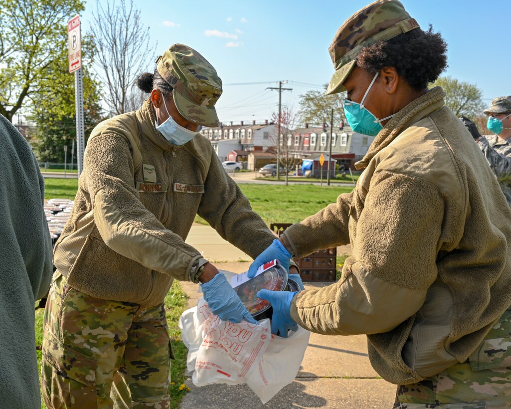 Members from the Maryland Air National Guard partnered with Baltimore County’s Police Athletic League recreation centers in support of their efforts to distribute meals and groceries to the local communities in Middle River, Md., April 11, 2020. The Maryland National Guard is supporting multiple food distribution sites in Baltimore City and County ensuring that residents are still able to have meals while schools and work places are closed. (U.S. Air National Guard photo by Staff Sgt. Enjoli Saunders)