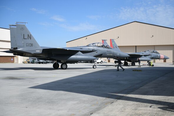 Photo shows two F-15 aircraft on the flight line