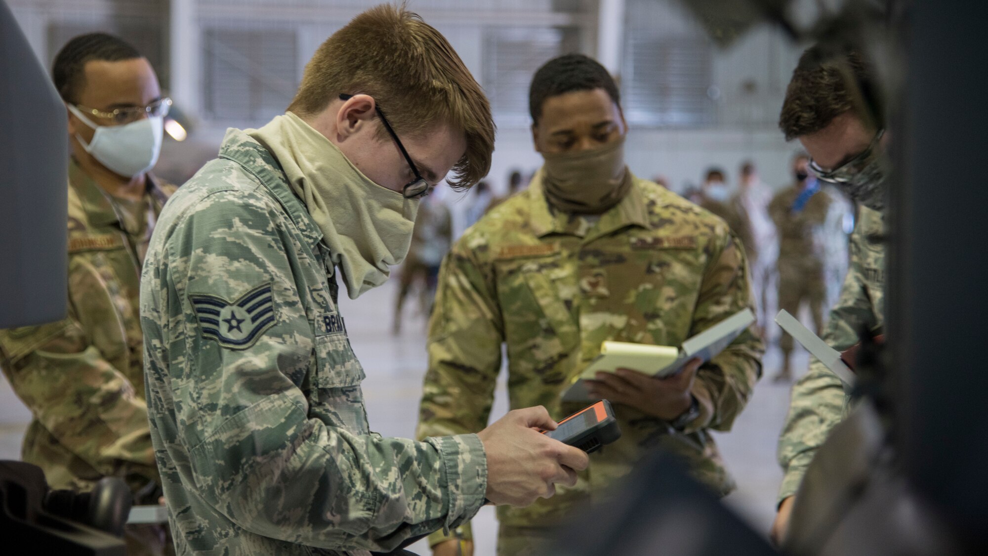Staff Sgt. Jonathan Bradley, 9th Aircraft Maintenance Unit weapons load crew chief, reviews technical orders on a tablet during the first quarter load competition April 28, 2020, at Holloman Air Force Base, N.M. The event gave Airmen an opportunity to perform their munition loading skills to the best of their abilities while racing against the clock and their opponents. (U.S. Air Force photo by Senior Airman Collette Brooks)