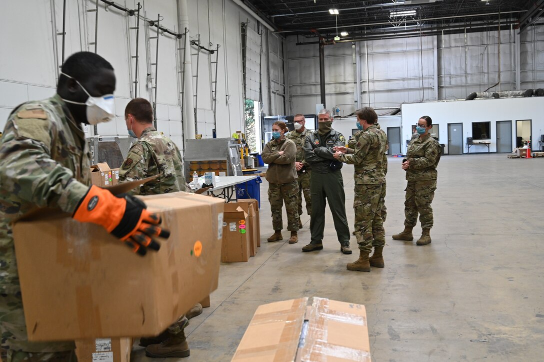 U.S. Air Force Brig. Gen. Paul Johnson, the 175th Wing commander, Maryland Air National Guard, and U.S. Air Force Col. Jori Robinson, 175th Wing vice commander, Maryland Air National Guard, visited a Strategic National Stockpile warehouse, April 16, to gain an understanding of the mission Airmen have been performing there during the state's response to the COVID-19 pandemic. Members from various units have been assisting the Maryland Office of Preparedness and Response with organizing and preparing delivery of medical PPE and life-saving ventilators to local hospitals and county health departments from their warehouse. (U.S. Air National Guard photo by Staff Sgt. Enjoli Saunders)