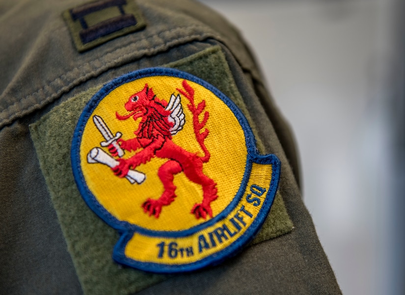 Capt. Sophia Schmidt, 16th Airlift Squadron Operations Support Flight assistant flight commander, wears a 16th AS squadron patch at Joint Base Charleston, S.C., April 29, 2020.
