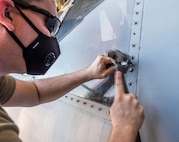 Senior Airman Spencer Coole, an aircraft structural maintenance journeyman assigned to the 437th Aircraft Maintenance Squadron, removes a stripped screw while replacing a window on the flightdeck of a C-17 Globemaster III aircraft at Joint Base Charleston, S.C., April 28, 2020. The 437th AMXS is still generating aircraft to support local training flights, missions from Air Mobility Command and supporting training for aeromedical evacuation personnel while being critically manned during the COVID-19 pandemic. The 437th AMXS is also implementing physical distancing when possible and following other Centers for Disease Control guidelines. Additionally, they have trained some of their personnel to decontaminate aircraft before and after missions to keep aircrews and 437th AMXS personnel safe. (U.S. Air Force Photo by Staff Sgt. Megan Munoz)