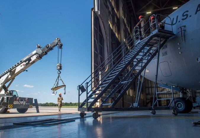 Airmen assigned to the 437th Aircraft Maintenance Squadron install a new window in the flightdeck of a C-17 Globemaster III aircraft at Joint Base Charleston, S.C., April 28, 2020. The 437th AMXS is still generating aircraft to support local training flights, missions from Air Mobility Command and supporting training for aeromedical evacuation personnel while being critically manned during the COVID-19 pandemic. The 437th AMXS is also implementing physical distancing when possible and following other Centers for Disease Control guidelines. Additionally, they have trained some of their personnel to decontaminate aircraft before and after missions to keep aircrews and 437th AMXS personnel safe. (U.S. Air Force Photo by Staff Sgt. Megan Munoz)