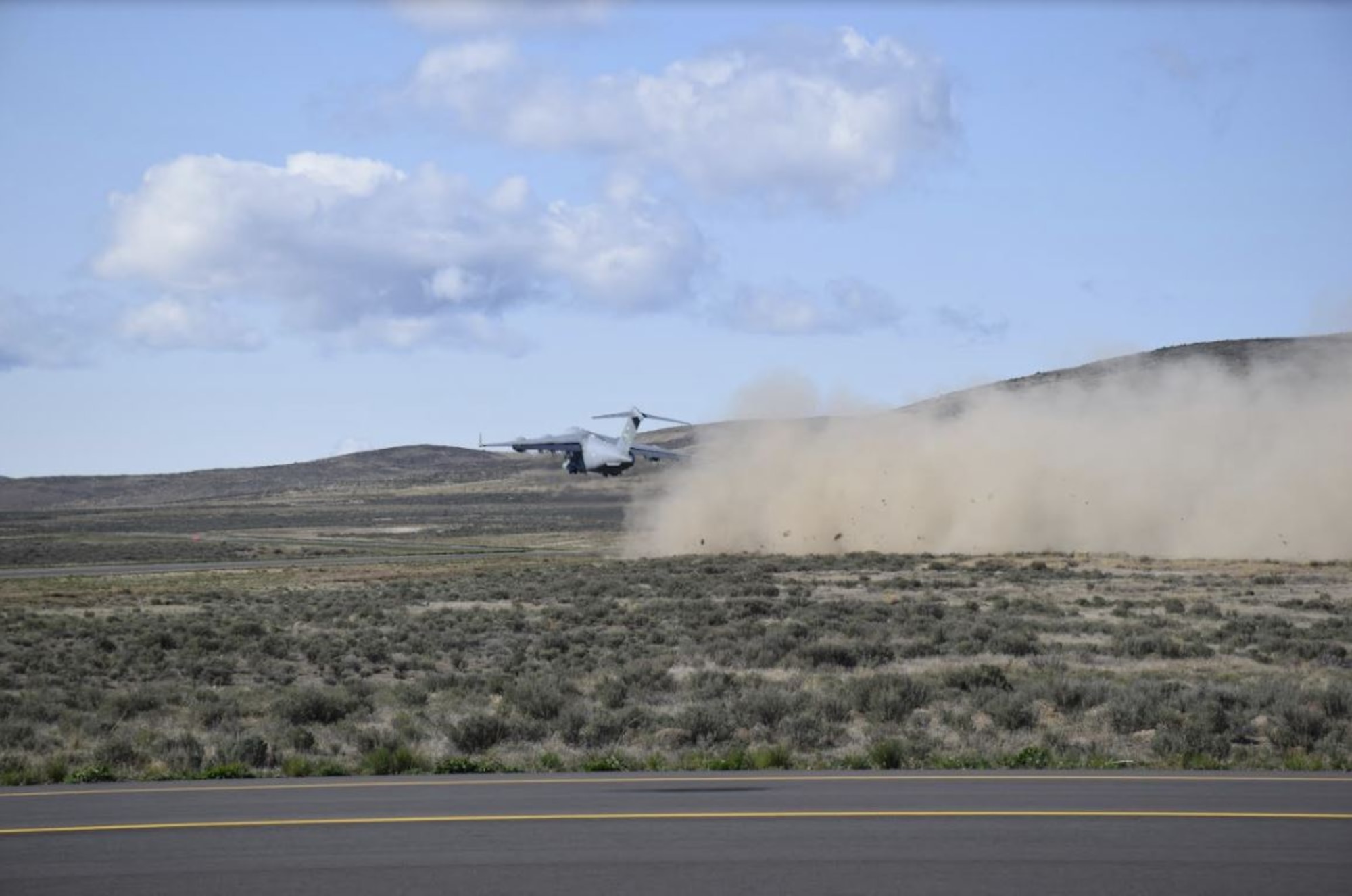 A C-17 Globemaster III takes off from the Mettie Airstrip at Yakima Training Center, Wash., April 23, 2020. Instructors and students of the C-17 Weapons Instructor Course (WIC) taught out of the 57th Weapons Squadron on Joint Base Lewis-McChord, Wash. conducted an aeromedical evacuation exercise as part of the scenario based training phase of the WIC. (Courtesy Photo)