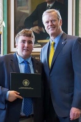 Zack Fernandez, Army family member, poses with Massachusetts Gov. Charlie Baker, at the State House in Boston, Mass., after being named the Hanscom Air Force Base 2019 Youth of the Year. Fernandez is the first member to receive the title in back-to-back years. (Courtesy photo)