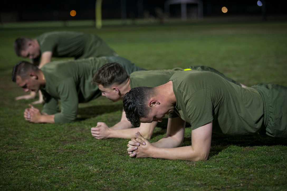 U.S. Marines and Sailors assigned to Headquarters and Headquarters Squadron (H&HS), Marine Corps Air Station (MCAS) Yuma, participate in a squadron phsyical training (PT) event on MCAS Yuma, March 6, 2020.