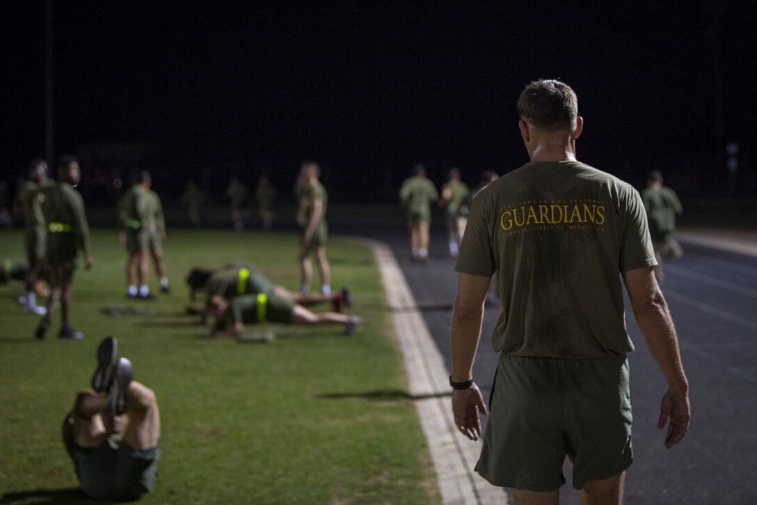 U.S. Marines and Sailors assigned to Headquarters and Headquarters Squadron (H&HS), Marine Corps Air Station (MCAS) Yuma, participate in a squadron phsyical training (PT) event on MCAS Yuma, March 6, 2020.