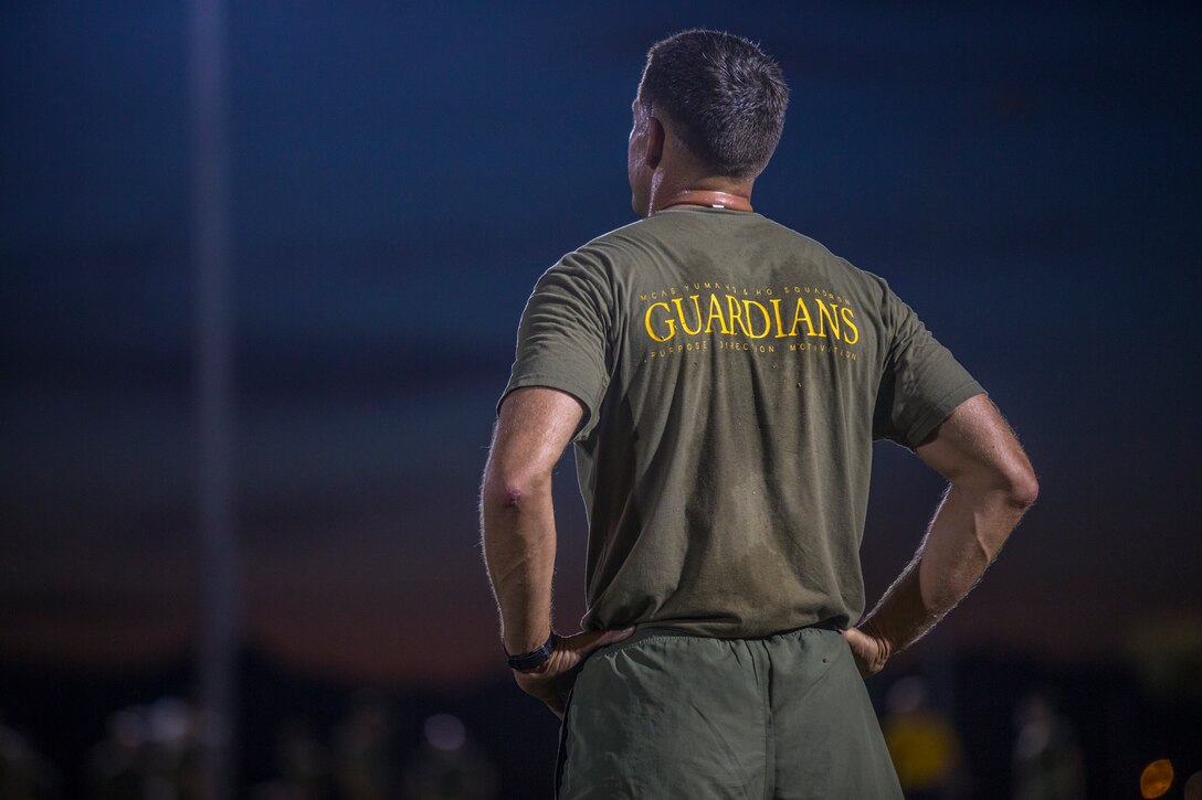 U.S. Marines and Sailors assigned to Headquarters and Headquarters Squadron (H&HS), Marine Corps Air Station (MCAS) Yuma, participate in a squadron phsyical training (PT) event on MCAS Yuma, March 6, 2020.