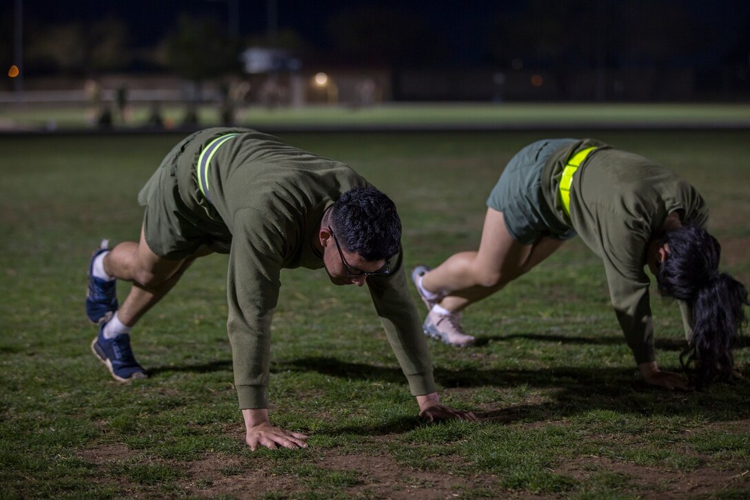 U.S. Marines and Sailors assigned to Headquarters and Headquarters Squadron (H&HS), Marine Corps Air Station (MCAS) Yuma, participate in a squadron phsyical training (PT) event on MCAS Yuma, March 6, 2020.