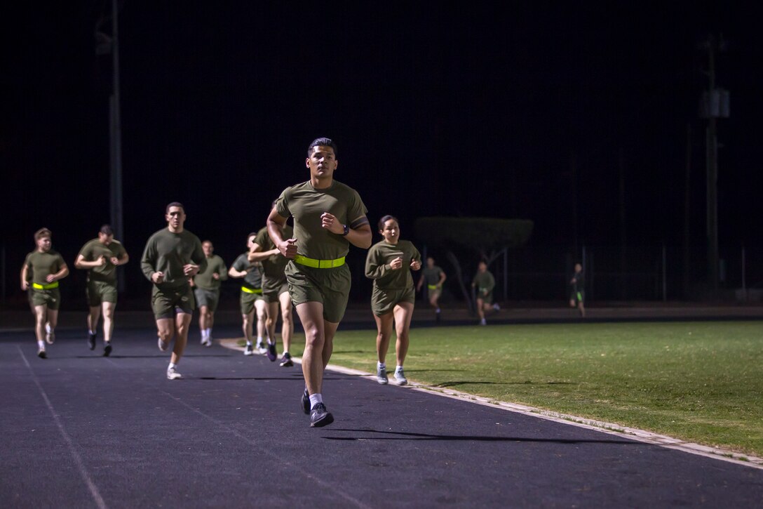 U.S. Marines and Sailors assigned to Headquarters and Headquarters Squadron (H&HS), Marine Corps Air Station (MCAS) Yuma, participate in a squadron phsyical training (PT) event on MCAS Yuma, March 6, 2020.