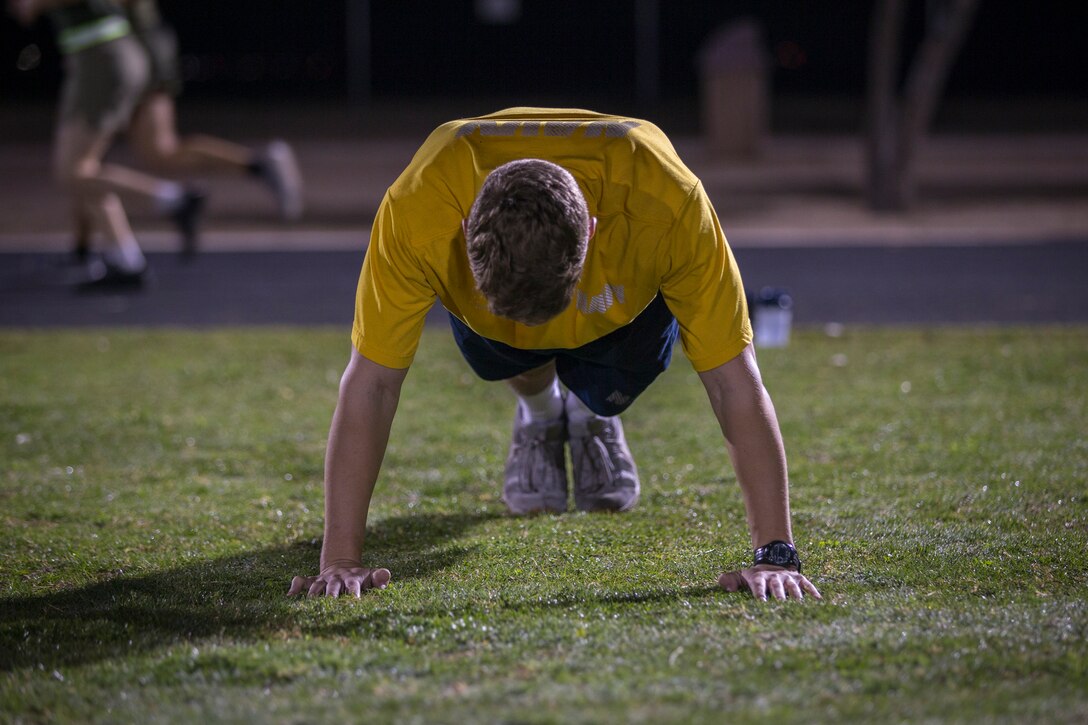 U.S. Marines and Sailors assigned to Headquarters and Headquarters Squadron (H&HS), Marine Corps Air Station (MCAS) Yuma, participate in a squadron phsyical training (PT) event on MCAS Yuma, March 6, 2020.