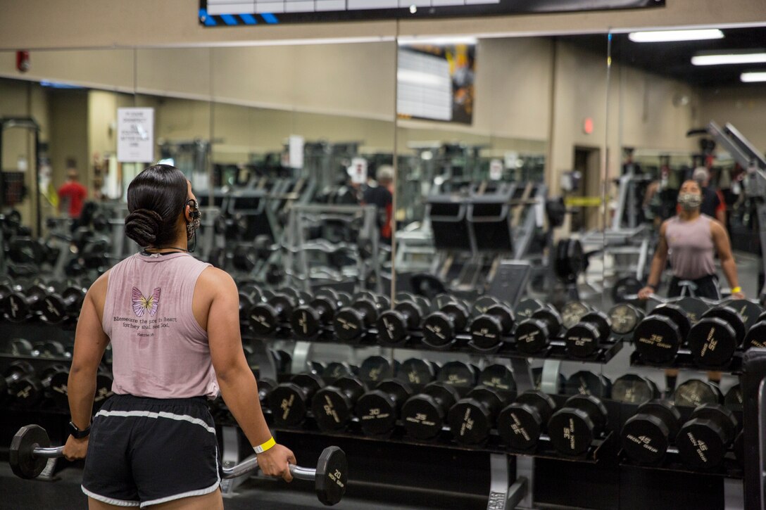 A service member works out at the station gym on Marine Corps Air Station Yuma, April 30, 2020. The gym reopend with extra precautions set in place to keep service members and gym employees safe. (U.S. Marine Corps Photo by Cpl. Nicole Rogge