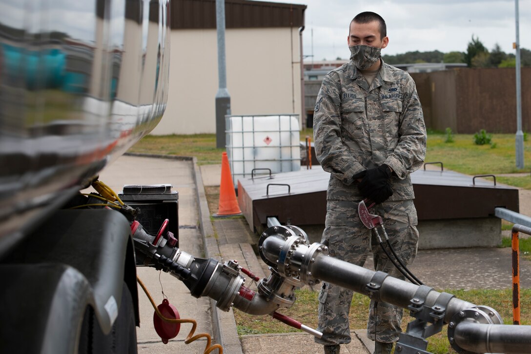 Airman 1st Class Issac Ellis, a 48th Logistics Readiness Squadron fuels mobile distribution operator, refills an R-11 refueling truck from bulk storage at Royal Air Force Lakenheath, England, April 30, 2020. 48th LRS Airmen have worked hard to continue the mission of keeping the Liberty Wing mission-ready despite the current COVID-19 crisis. (U.S. Air Force photo by Airman 1st Class Jessi Monte)