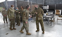 Chief of Staff of the Air Force General David L. Goldfein and Chief Master Sergeant of the Air Force Kaleth O. Wright greet Airmen after being briefed about the Transportation Isolation System at Joint Base Charleston, S.C., April 30, 2020. The senior leaders visited JB Charleston to observe many of the precautions and systems being used in response to the current COVID-19 situation (U.S. Air Force photo by Senior Airman Cody R. Miller)
