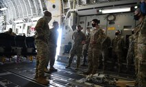 Chief of Staff of the Air Force General David L. Goldfein and Chief Master Sergeant of the Air Force Kaleth O. Wright are briefed about the Transportation Isolation System onboard a C-17 Globemaster III at Joint Base Charleston, S.C., April 30, 2020. The senior leaders visited JB Charleston to observe many of the precautions and systems used in response to the current COVID-19 situation (U.S. Air Force photo by Senior Airman Cody R. Miller)