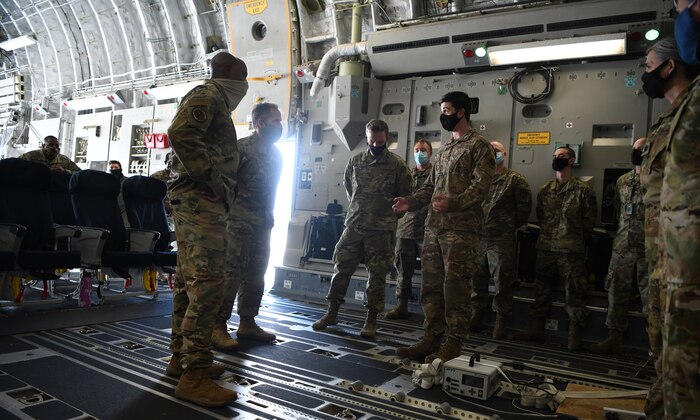 Chief of Staff of the Air Force General David L. Goldfein and Chief Master Sergeant of the Air Force Kaleth O. Wright are briefed about the Transportation Isolation System onboard a C-17 Globemaster III at Joint Base Charleston, S.C., April 30, 2020. The senior leaders visited JB Charleston to observe many of the precautions and systems used in response to the current COVID-19 situation (U.S. Air Force photo by Senior Airman Cody R. Miller)