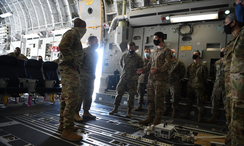 Chief of Staff of the Air Force General David L. Goldfein and Chief Master Sergeant of the Air Force Kaleth O. Wright are briefed about the Transportation Isolation System onboard a C-17 Globemaster III at Joint Base Charleston, S.C., April 30, 2020. The senior leaders visited JB Charleston to observe many of the precautions and systems used in response to the current COVID-19 situation (U.S. Air Force photo by Senior Airman Cody R. Miller)