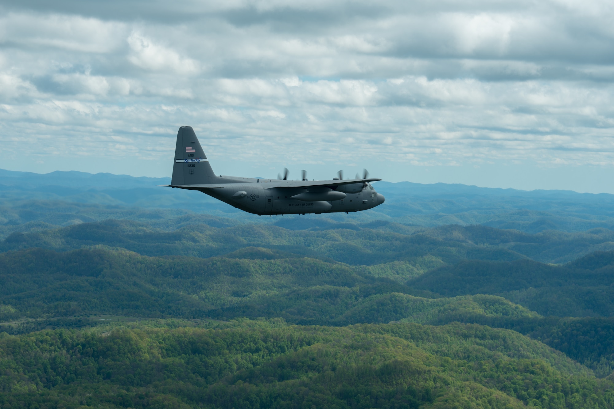 A Kentucky Air National Guard C-130 Hercules flies over the commonwealth of Kentucky as part of Operation American Resolve on Friday, May 1, 2020.  The 123rd Airlift Wing sent two C-130s for the aerial demonstration that is a nationwide salute to all those supporting COVID-19 response efforts. The flyover is intended to lift morale during a time of severe health and economic impacts that have resulted from COVID-19. (U.S. Air National Guard photo by Phil Speck)