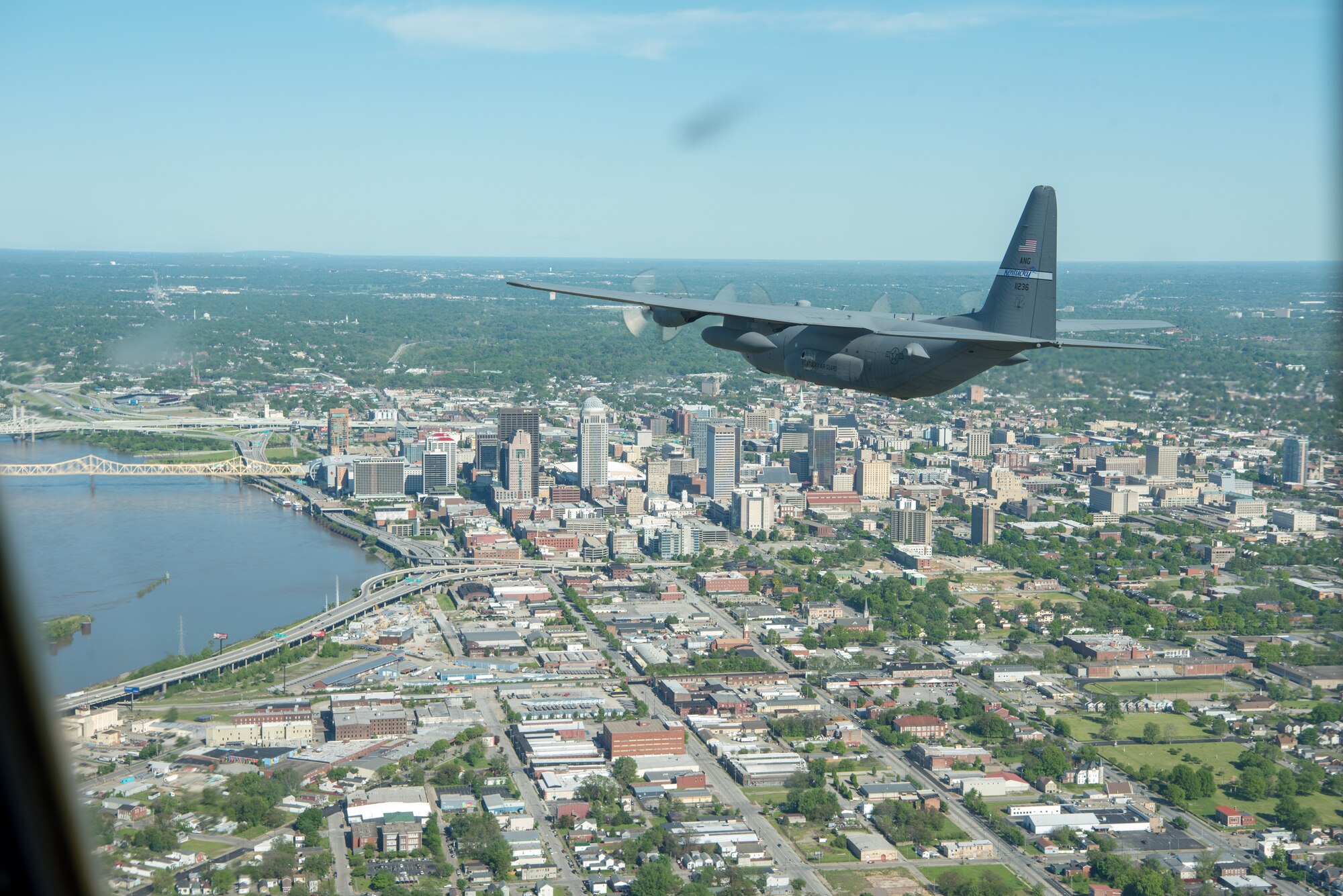 A Kentucky Air National Guard C-130 Hercules flies over the commonwealth of Kentucky as part of Operation American Resolve on Friday, May 1, 2020.  The 123rd Airlift Wing sent two C-130s for the aerial demonstration that is a nationwide salute to all those supporting COVID-19 response efforts. The flyover is intended to lift morale during a time of severe health and economic impacts that have resulted from COVID-19. (U.S. Air National Guard photo by Phil Speck)