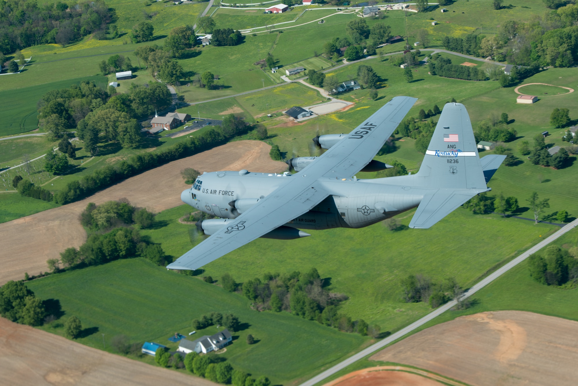 A Kentucky Air National Guard C-130 Hercules flies over the commonwealth of Kentucky as part of Operation American Resolve on Friday, May 1, 2020.  The 123rd Airlift Wing sent two C-130s for the aerial demonstration that is a nationwide salute to all those supporting COVID-19 response efforts. The flyover is intended to lift morale during a time of severe health and economic impacts that have resulted from COVID-19. (U.S. Air National Guard photo by Phil Speck)