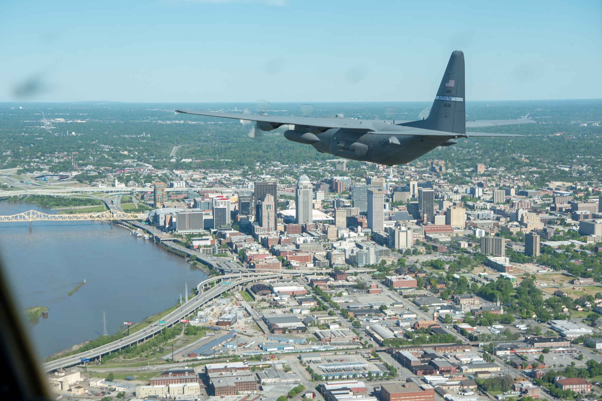 A Kentucky Air National Guard C-130 Hercules flies over the commonwealth of Kentucky as part of Operation American Resolve on Friday, May 1, 2020.  The 123rd Airlift Wing sent two C-130s for the aerial demonstration that is a nationwide salute to all those supporting COVID-19 response efforts. The flyover is intended to lift morale during a time of severe health and economic impacts that have resulted from COVID-19. (U.S. Air National Guard photo by Phil Speck)