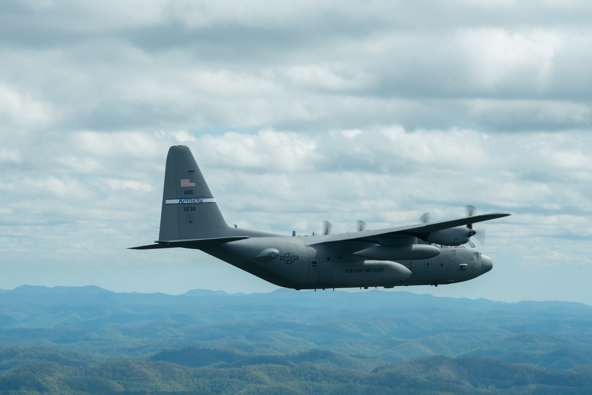 A Kentucky Air National Guard C-130 Hercules flies over the commonwealth of Kentucky as part of Operation American Resolve on Friday, May 1, 2020.  The 123rd Airlift Wing sent two C-130s for the aerial demonstration that is a nationwide salute to all those supporting COVID-19 response efforts. The flyover is intended to lift morale during a time of severe health and economic impacts that have resulted from COVID-19. (U.S. Air National Guard photo by Phil Speck)