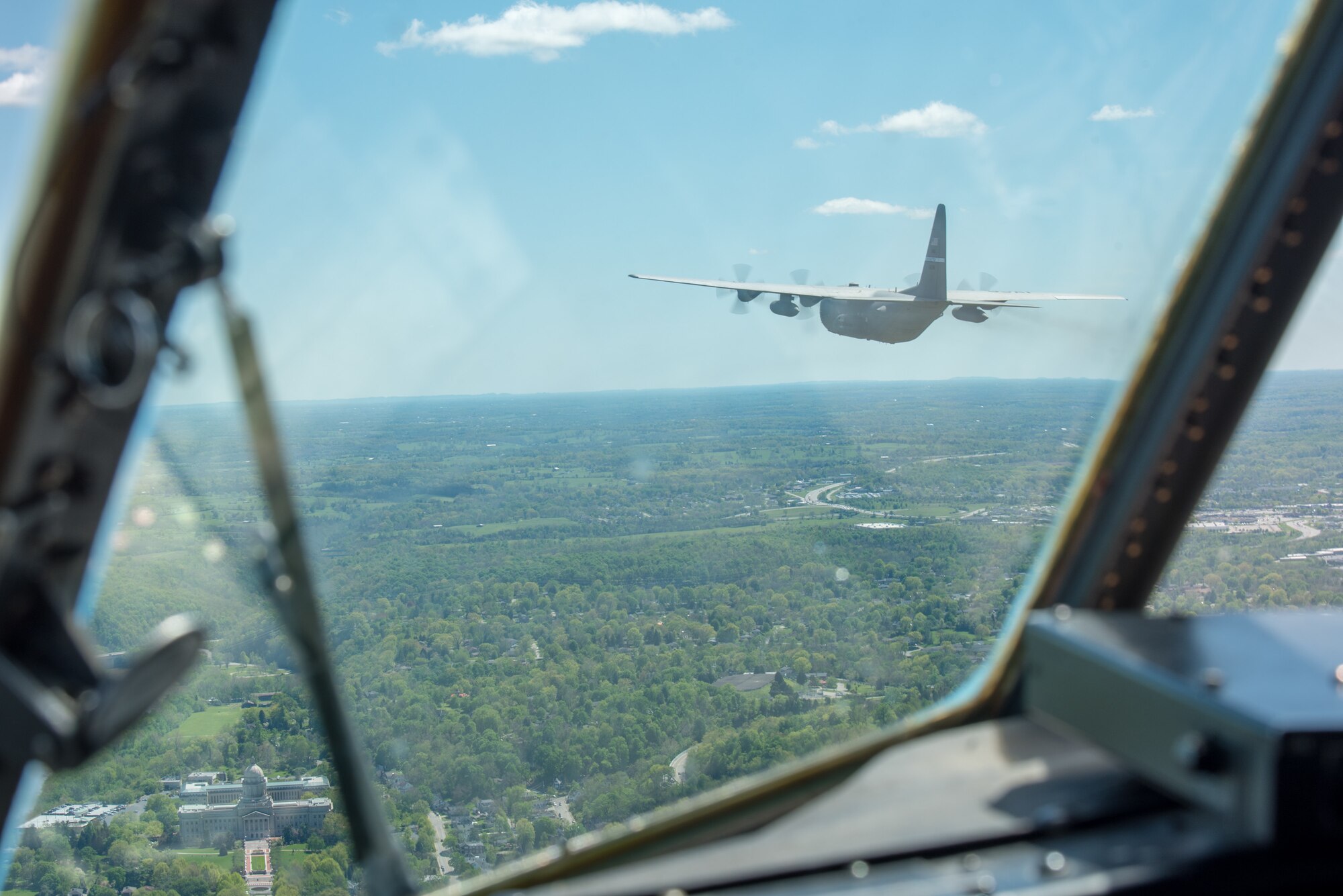 A Kentucky Air National Guard C-130 Hercules flies over the commonwealth of Kentucky as part of Operation American Resolve on Friday, May 1, 2020.  The 123rd Airlift Wing sent two C-130s for the aerial demonstration that is a nationwide salute to all those supporting COVID-19 response efforts. The flyover is intended to lift morale during a time of severe health and economic impacts that have resulted from COVID-19. (U.S. Air National Guard photo by Phil Speck)