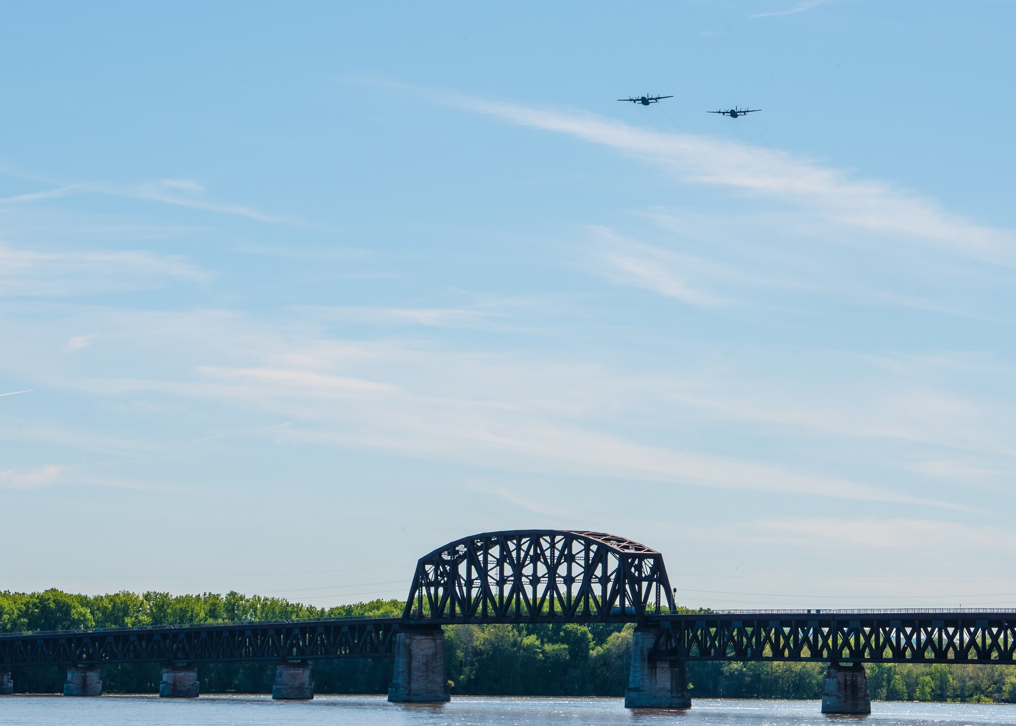 Two Kentucky Air National Guard C-130 Hercules aircraft from the 123rd Airlift Wing fly over Louisville, Ky., May 1, 2020, as part of Operation American Resolve, a nationwide salute to all those supporting COVID-19 response efforts. The operation is intended to lift morale during a time of severe health and economic impacts that have resulted from COVID-19. (U.S. Air National Guard photo by Senior Airman Chloe Ochs)