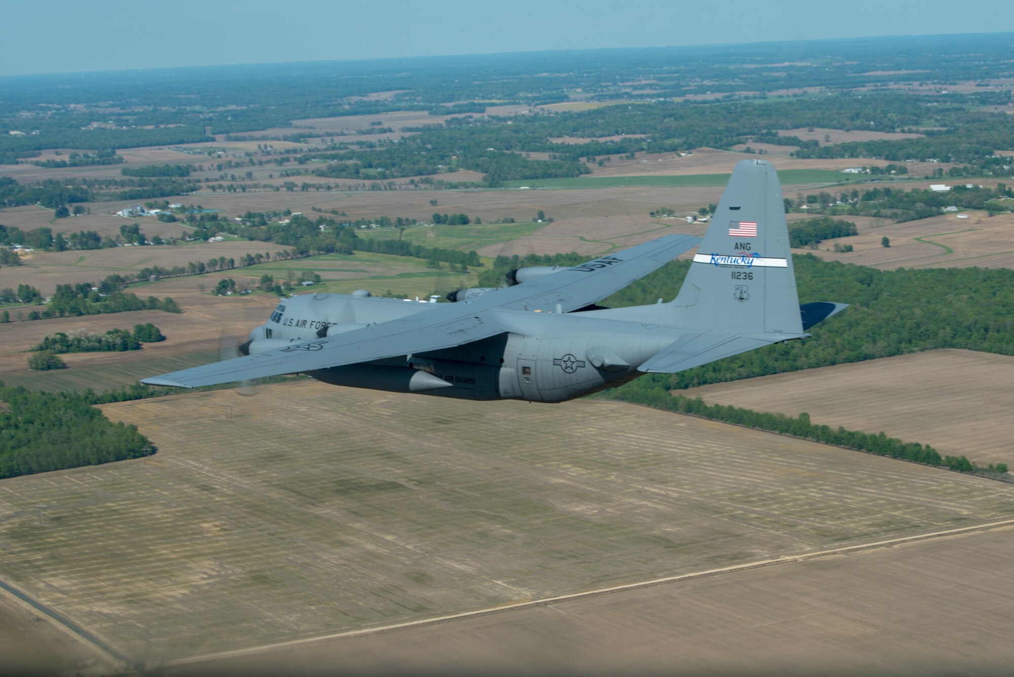 A Kentucky Air National Guard C-130 Hercules flies over the commonwealth of Kentucky as part of Operation American Resolve on Friday, May 1, 2020.  The 123rd Airlift Wing sent two C-130s for the aerial demonstration that is a nationwide salute to all those supporting COVID-19 response efforts. The flyover is intended to lift morale during a time of severe health and economic impacts that have resulted from COVID-19. (U.S. Air National Guard photo by Phil Speck)