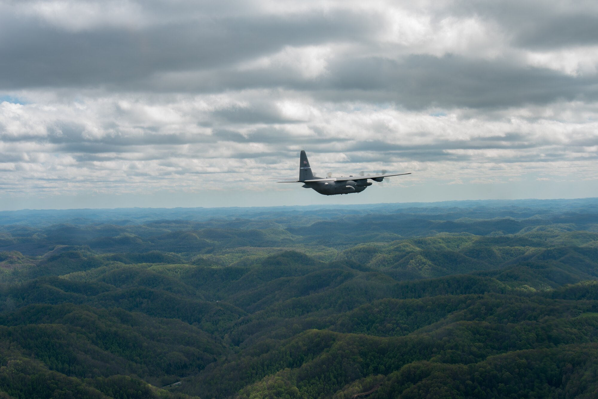 A Kentucky Air National Guard C-130 Hercules flies over the commonwealth of Kentucky as part of Operation American Resolve on Friday, May 1, 2020.  The 123rd Airlift Wing sent two C-130s for the aerial demonstration that is a nationwide salute to all those supporting COVID-19 response efforts. The flyover is intended to lift morale during a time of severe health and economic impacts that have resulted from COVID-19. (U.S. Air National Guard photo by Phil Speck)