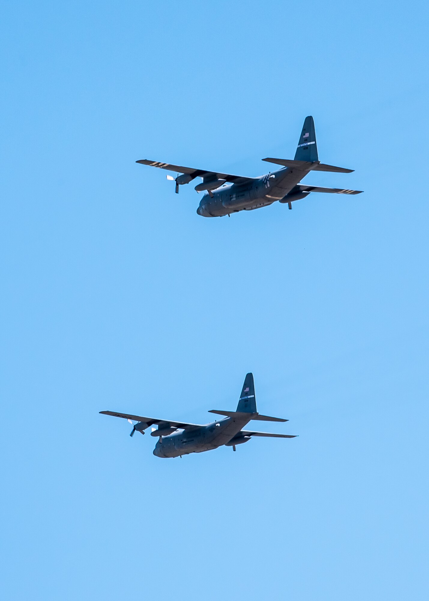 Two Kentucky Air National Guard C-130 Hercules aircraft from the 123rd Airlift Wing fly over Louisville, Ky., May 1, 2020, as part of Operation American Resolve, a nationwide salute to all those supporting COVID-19 response efforts. The operation is intended to lift morale during a time of severe health and economic impacts that have resulted from COVID-19. (U.S. Air National Guard photo by Senior Airman Chloe Ochs)