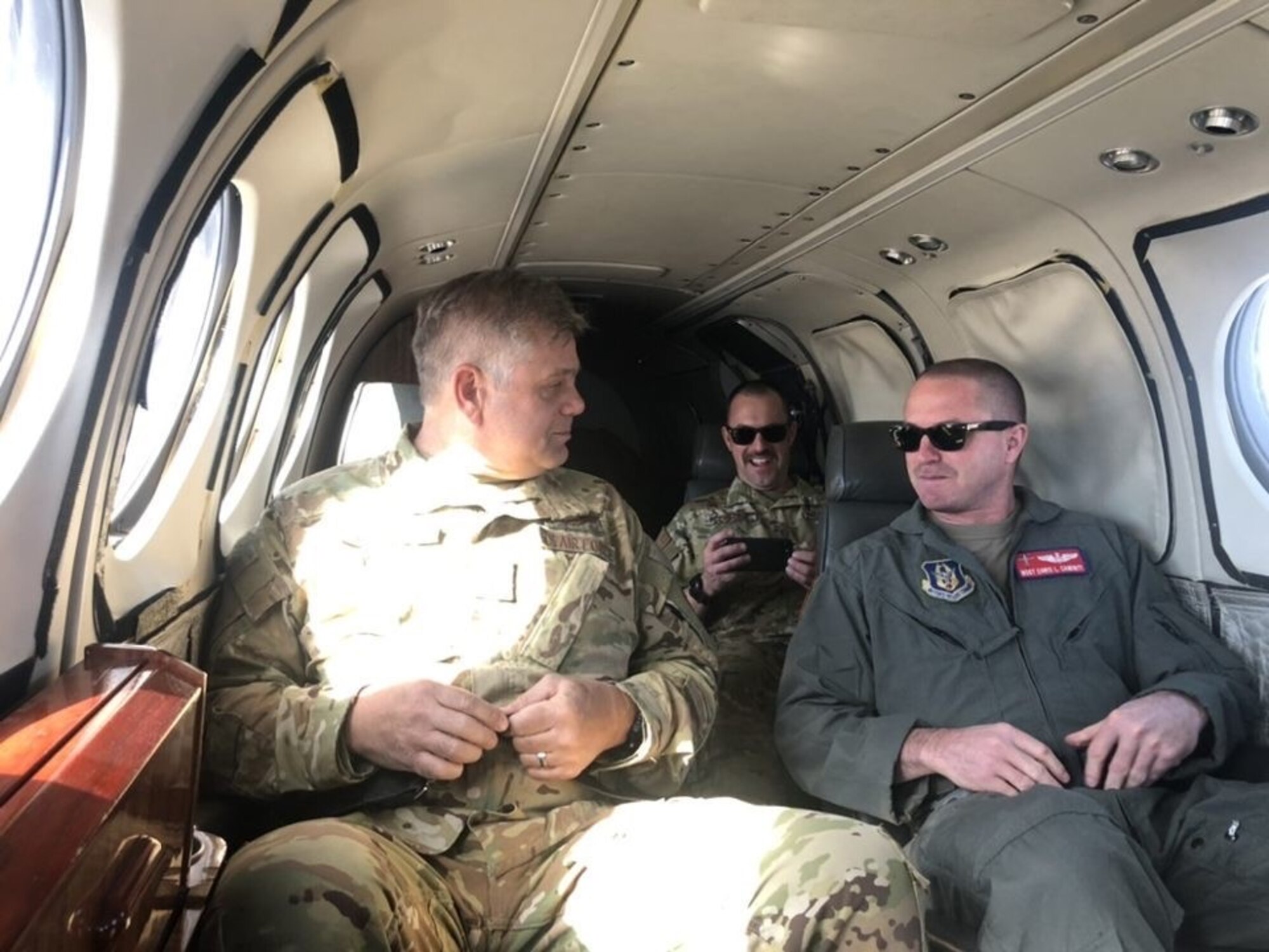 Aircrew sitting aboard a C-12 aircraft.