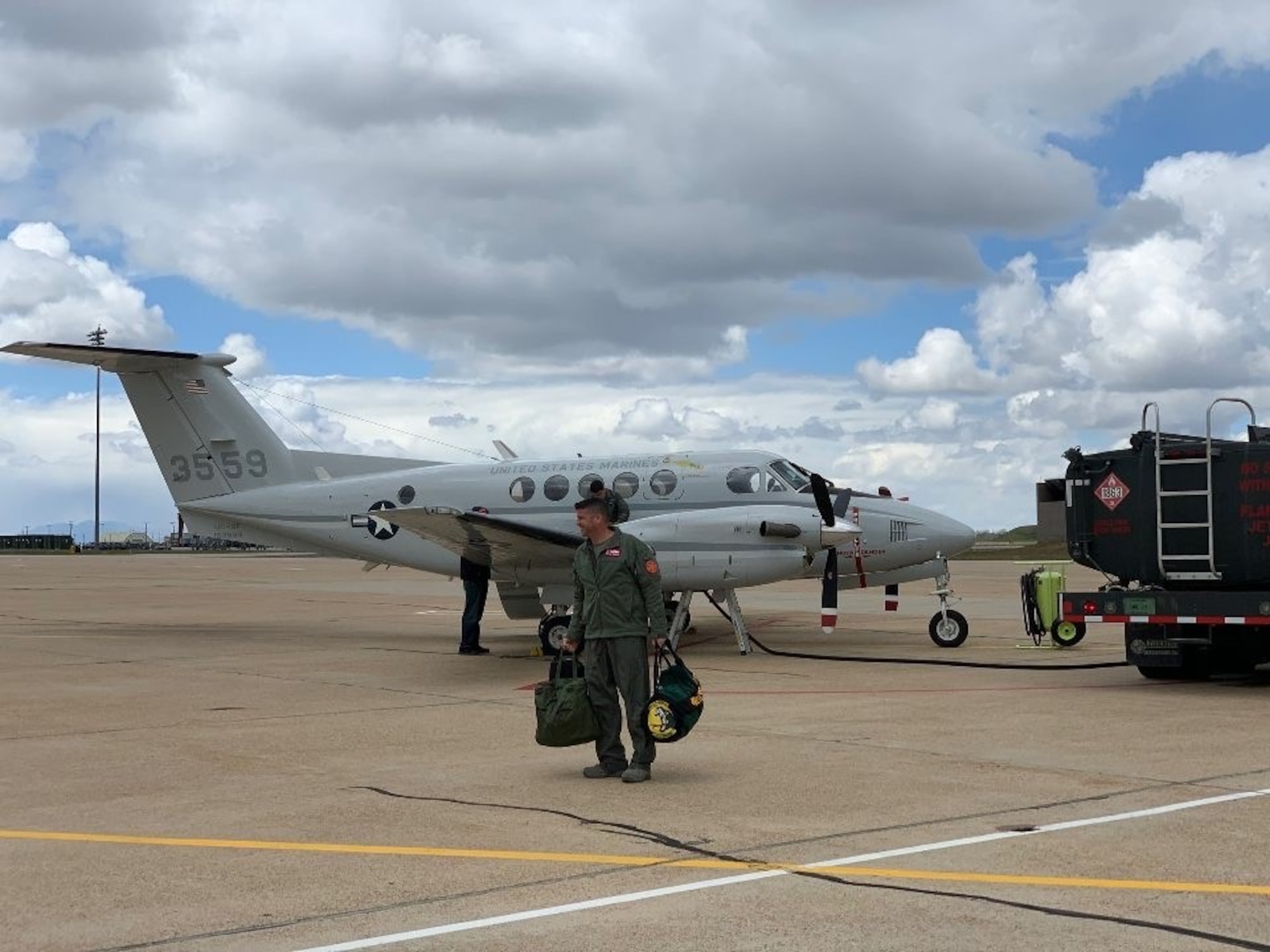 514th Flight Test Squadron Commander Lt. Col. Nathan Litz walking toward a C-12 aircraft.