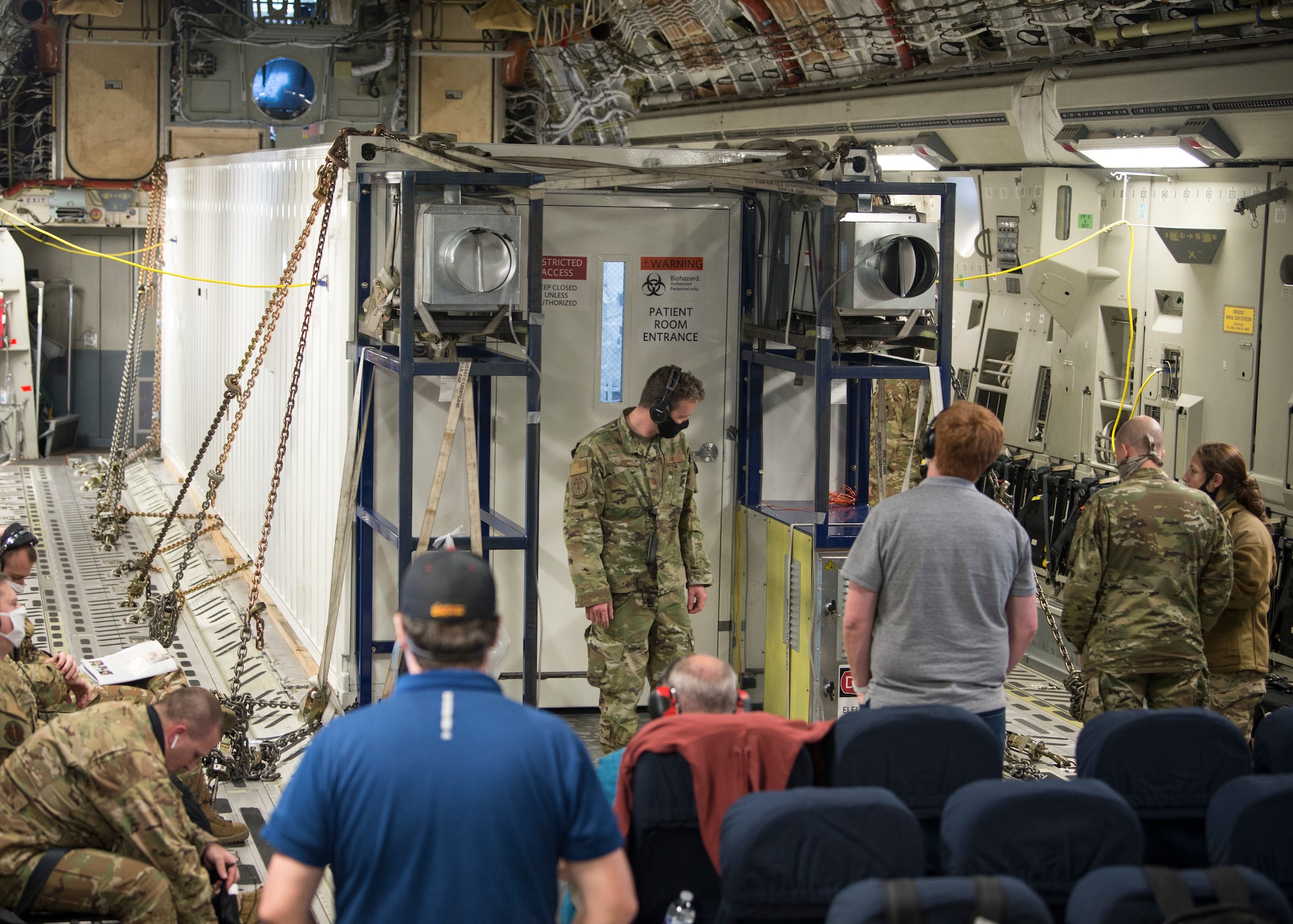 In-flight testing is conducted to certify a Negatively Pressurized Conex prototype on a C-17 Globemaster III, April 30, 2020. The NPC is designed to transport individuals with the COVID-19 virus and other highly infectious diseases, all while preventing the aircrew and medical professionals onboard from being exposed. (U.S. Air Force photo by Staff Sgt. Chris Drzazgowski)