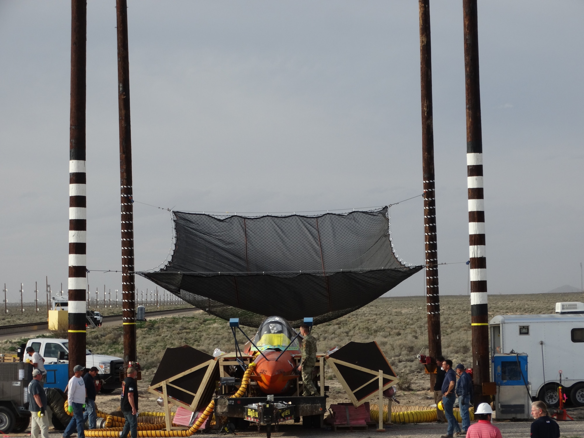 The test team from the 846th Test Squadron, the Joint Strike Fighter and the manufacturers perform final checkouts and configurations prior to a “worst-case scenario” F-35 static canopy test in which the ejection seat must push through the canopy at 0 knots, with an overheated canopy on March 27, 2020, at Holloman Air Force Base, N.M. (U.S. Air Force photo by Timothy Gros)