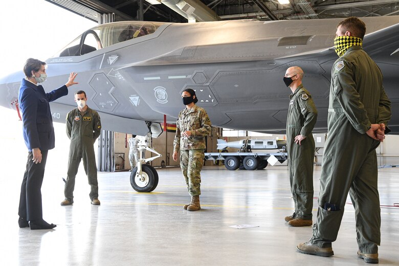 Secretary of the Air Force Barbara Barrett speaks with 388th and 419th Fighter Wings leadership in front of an F-35A Lightning II aircraft.