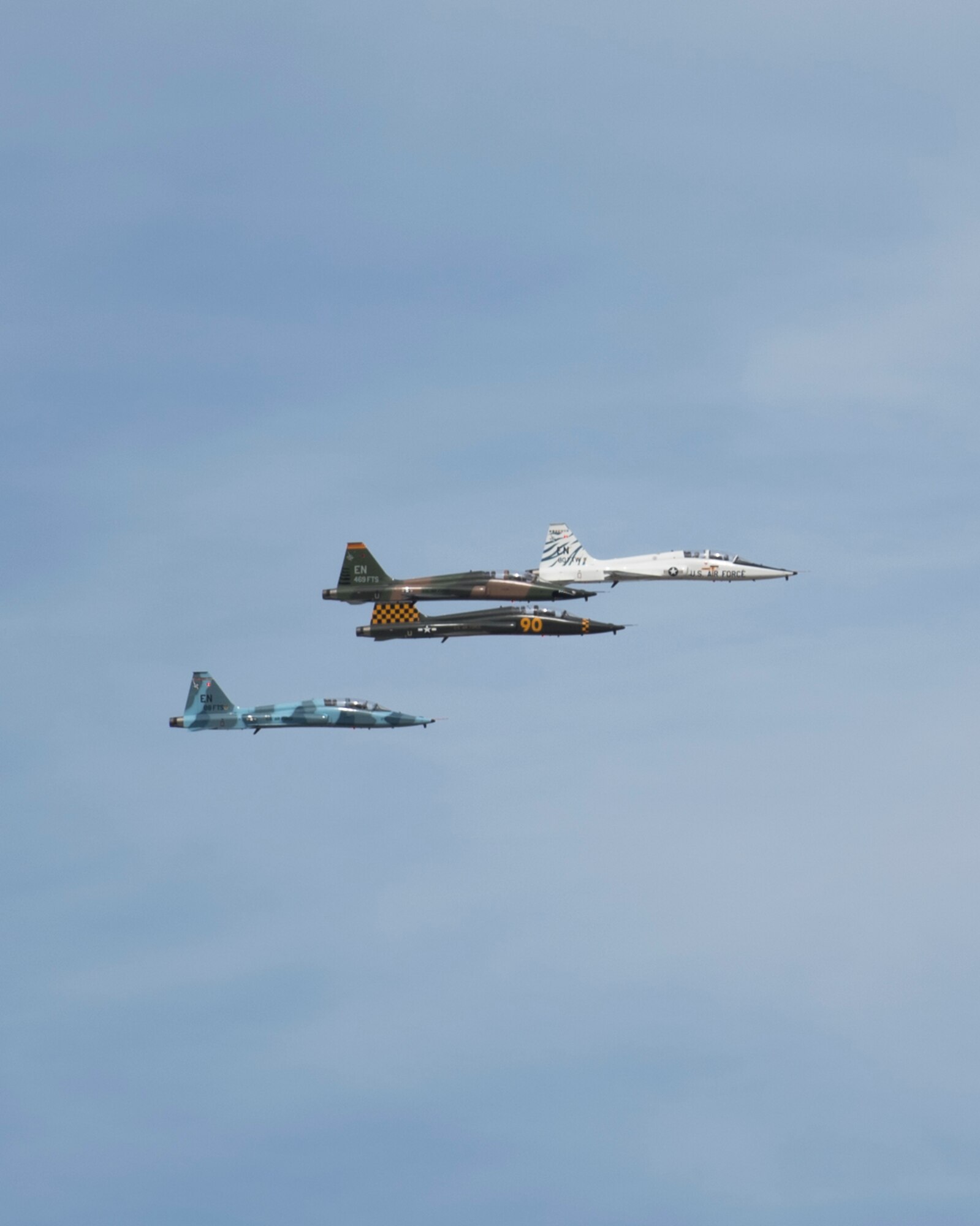 Four T-38 Talon aircraft participate in the Spirit of Texoma flyover on May 1, 2020. The flyover was a way for Sheppard Air Force Base, Texas, to show gratitude towards the COVID-19 frontline healthcare workers in the local community. The flyover consisted of a 4-ship T-38 Talon formation and a 4-ship T-6 Texan II formation, with a T-38 and T-6 chase plane behind them for photo and video. (U. S. Air Force photo by Senior Airman Pedro Tenorio)