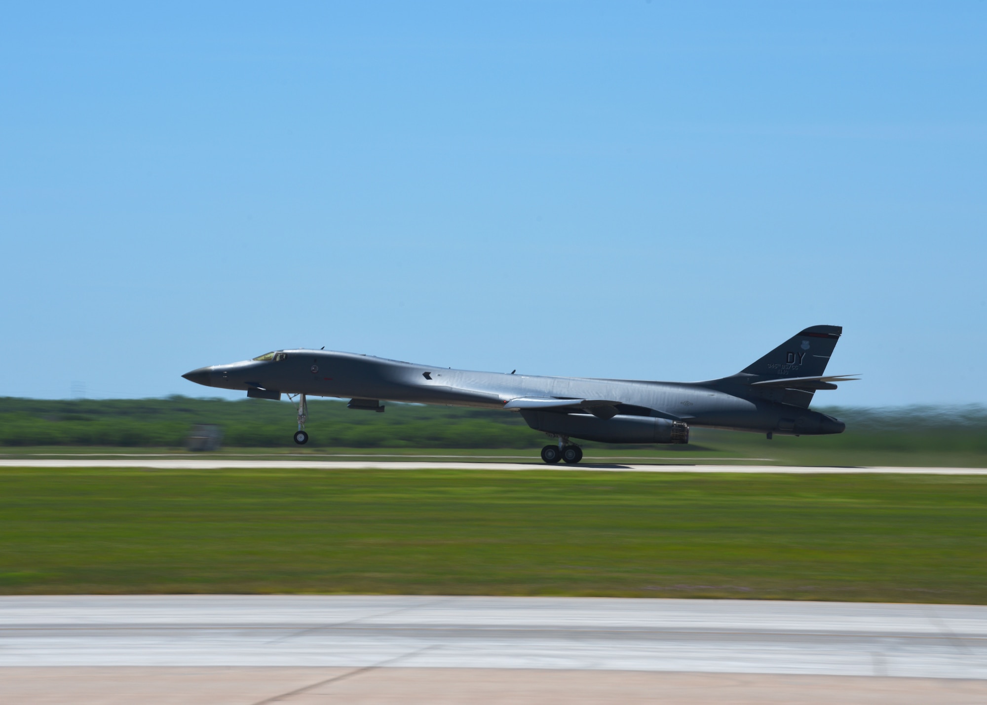 A B-1B from the 9th Bomb Squadron Lancer takes off for a Bomber Task Force deployment at Dyess Air Force Base, Texas, April 30, 2020. Four B-1Bs deployed to Andersen Air Force Base, Guam, As part of U.S. Strategic Command’s support to the National Defense Strategy objectives of strategic predictability and operational unpredictability by using a mix of different aircraft to and from various dispersed U.S. bases and other departure and arrival points, to include Guam. (U.S. Air Force photo by Senior Airman Mercedes Porter)
