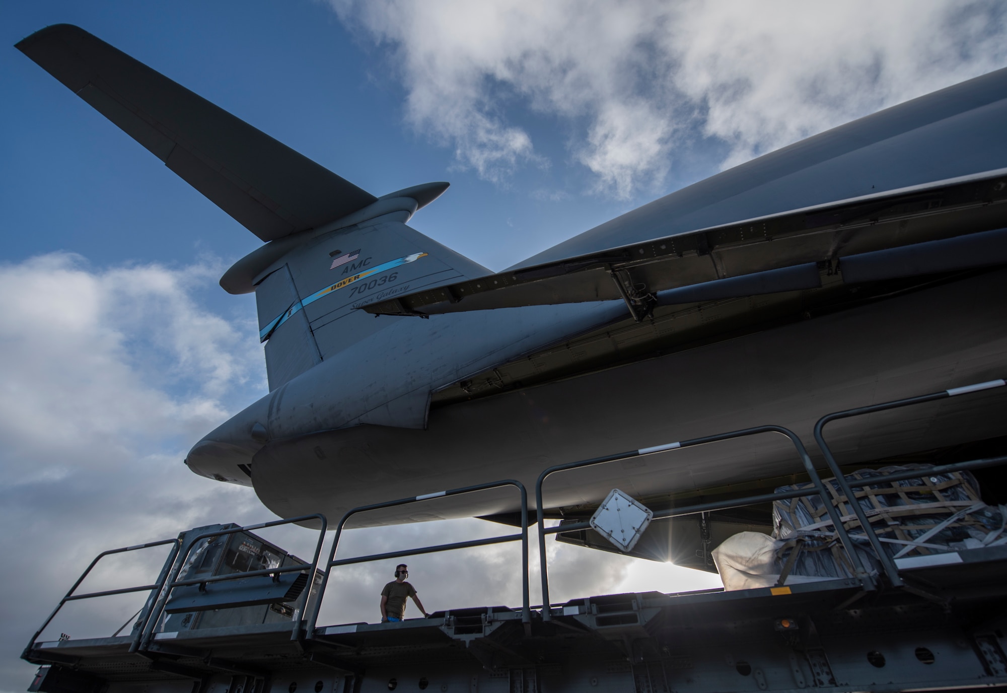 An Airman from the 36th Logistics Readiness Squadron unloads cargo from a C-5M Super Galaxy at Andersen Air Force Base, Guam, April 29, 2020. The C-5 delivered cargo for the 9th Expeditionary Bomb Squadron Bomber Task Force deployment. The BTF is deployed to Andersen AFB to support Pacific Air Forces’ training efforts with allies, partners and joint forces; and strategic deterrence missions to reinforce the rules-based order in the Indo-Pacific region. (U.S. Air Force photo by Senior Airman River Bruce)